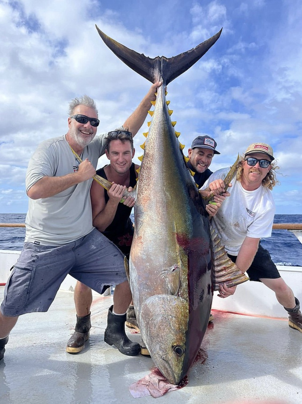 Angler with a massive bluefin tuna boat-side